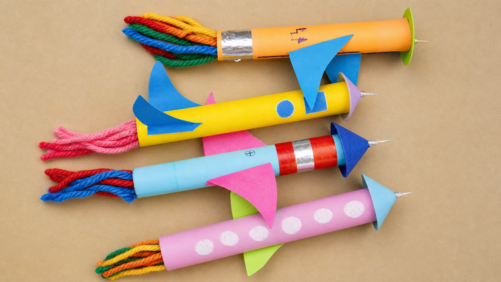 Four colorful handmade cardboard rockets