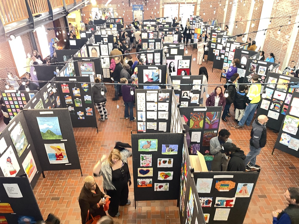 Overhead view of a large Boston Public Schools visual art exhibition
